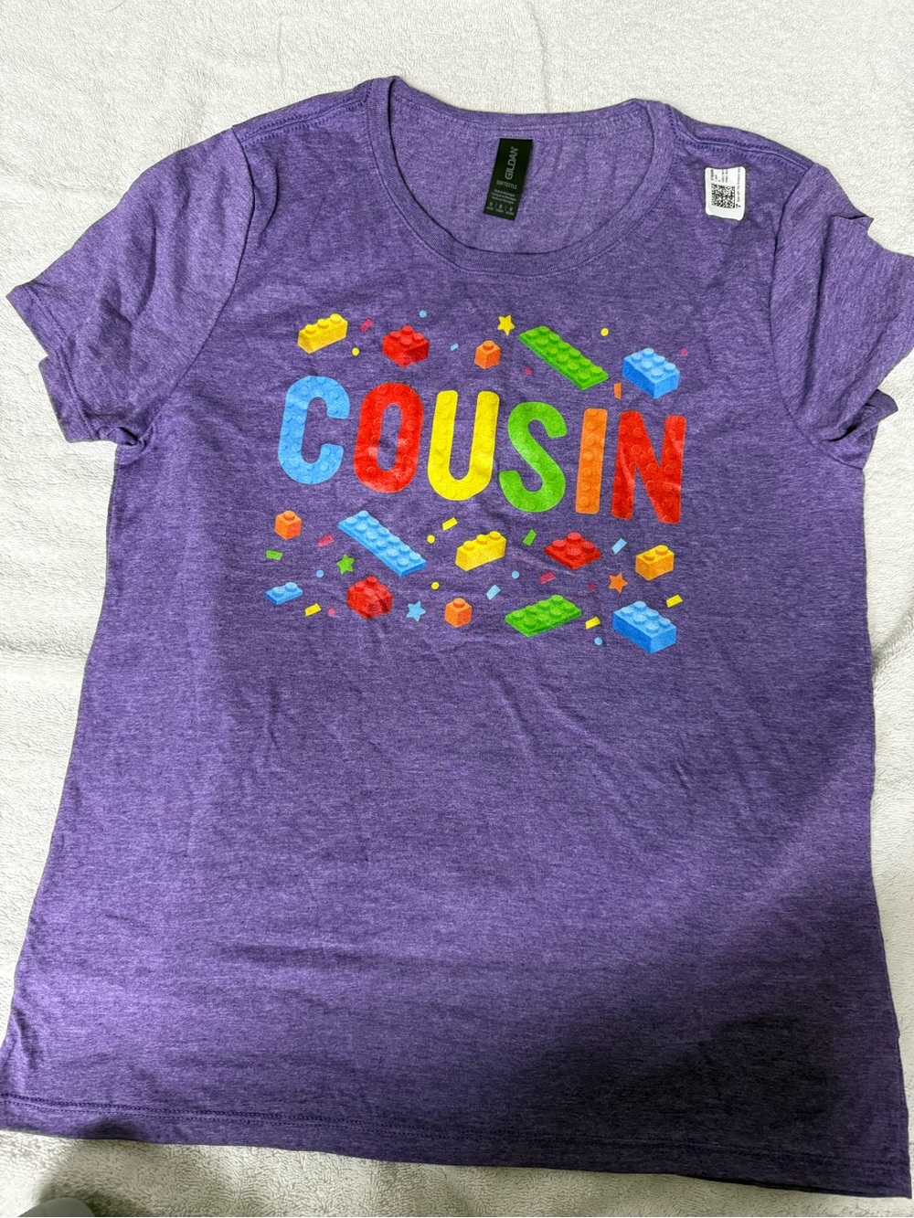 Gildan Purple Tee with Multicolor 'COUSIN' Brick Graphic